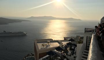 Sea view from a restaurant terrace during sunset.