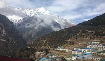 Namche Bazar with snow-capped mountains in the background.