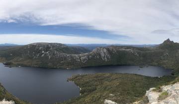 Scenic view of a large lake surrounded by mountains.