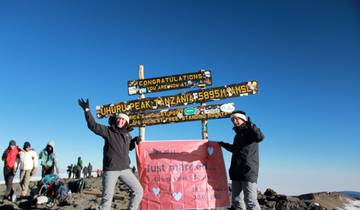 Celebratory photo at Uhuru Peak