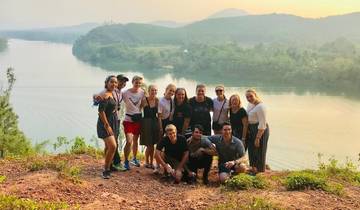 Group of people with a lake view at sunset.