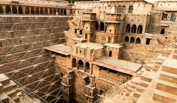 Abhaneri stepwell with geometric steps and intricate architecture.