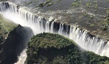 Aerial view of Victoria Falls with water cascading.