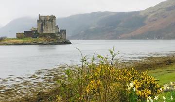 Castle on a small island with mountains