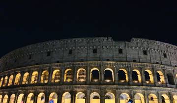 The Colosseum lit up at night.