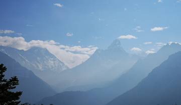Panoramic view of majestic mountains under a clear blue sky.