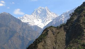 Snowy mountain peaks against a clear sky.