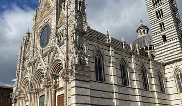 Cathedral facade with people around.