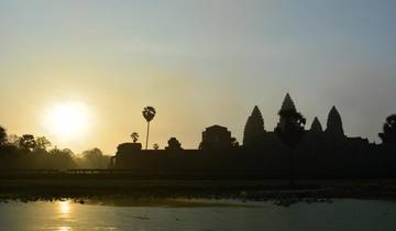 Silhouette of Angkor Wat temple during sunrise.