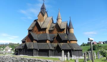 Wooden stave church with multiple roofs.