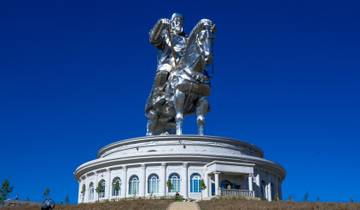 Large silver statue of a figure on horseback.