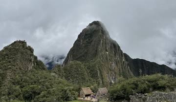 Iconic ruins with a mountain peak in the background.