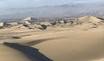 Expansive sand dunes stretching into the distance.