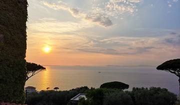 Sunset view over the sea with distant islands.