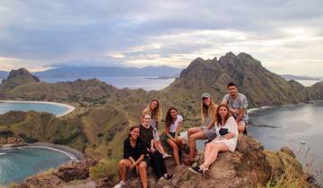 Group of people with stunning mountain and sea view