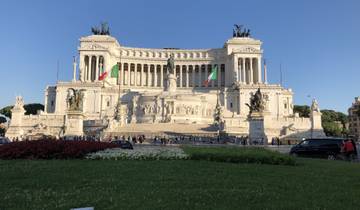Vittorio Emanuele II Monument in Rome, Italy, under clear blue skies.