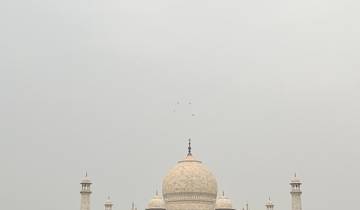 Majestic view of the Taj Mahal with its gardens.