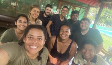 Group of people in a restaurant setting.