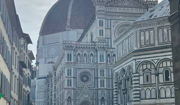 Exterior view of Florence Cathedral with people in the foreground.