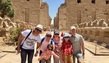 Group of people at an ancient Egyptian temple complex.