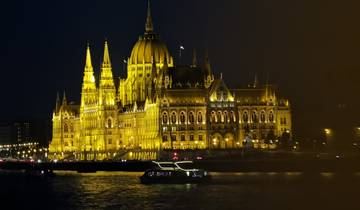The Hungarian Parliament Building illuminated at night.