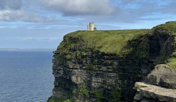 Cliffs with a grassy top and ocean view.