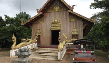 Thai temple with intricate dragon carvings.