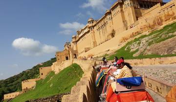 People riding elephants up to the Amber Fort.