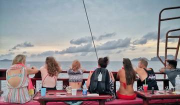 Group of people sitting and enjoying the view on a boat.