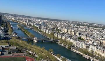 Aerial view of a city and river, with bridges crossing.