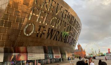 A large building with artistic lettering on its facade.