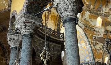 Intricate ceiling and columns inside a mosque.