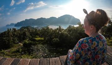 A person overlooking a scenic view of islands and ocean.