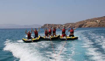 People water tubing in the sea.