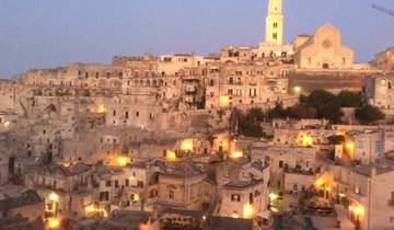Night view of an old city with glowing lights.
