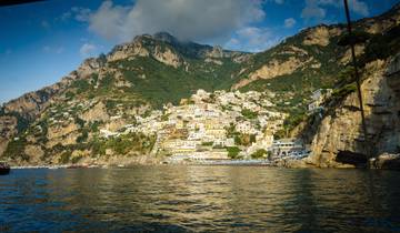 Hillside town with colorful buildings near the sea.