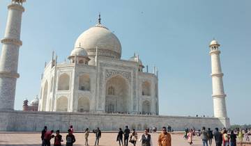 The Taj Mahal with visitors in front.
