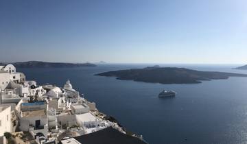 A view of the iconic Santorini landscape with sea and buildings.