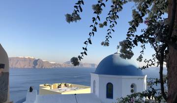 Blue-domed church overlooking the caldera.