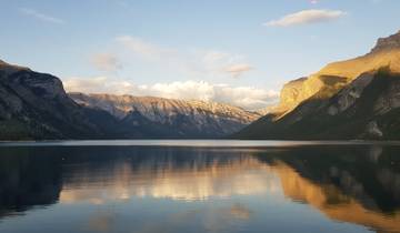 Lake with mountains in the background during sunset.