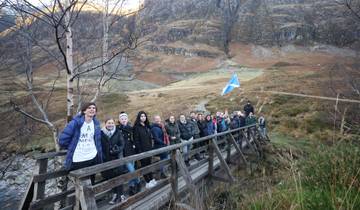Group photo on a bridge with a Scottish landscape around.