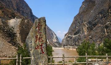 Rock with Chinese inscription in Tiger Leaping Gorge.