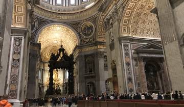 Interior of St. Peter's Basilica with altar and dome.