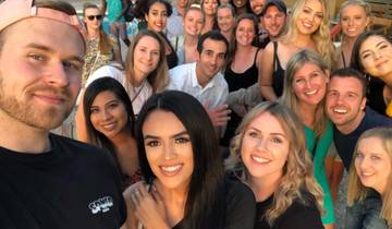 Group of people posing for a selfie.