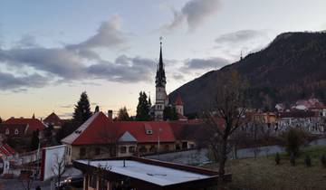 Beautiful sunset view over a town with a church steeple.