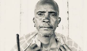 Black and white portrait of an elderly man.