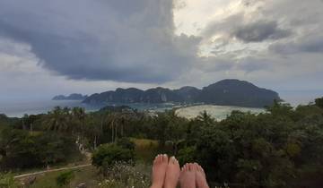 Panoramic view of a bay with feet in the foreground.