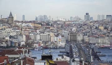 Cityscape of Istanbul with Galata Tower and a bridge over a river.