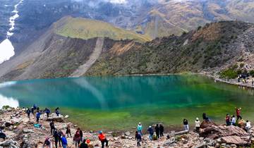 Crystal-clear turquoise lake surrounded by mountains.