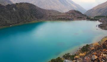 Panoramic view of a turquoise mountain lake.